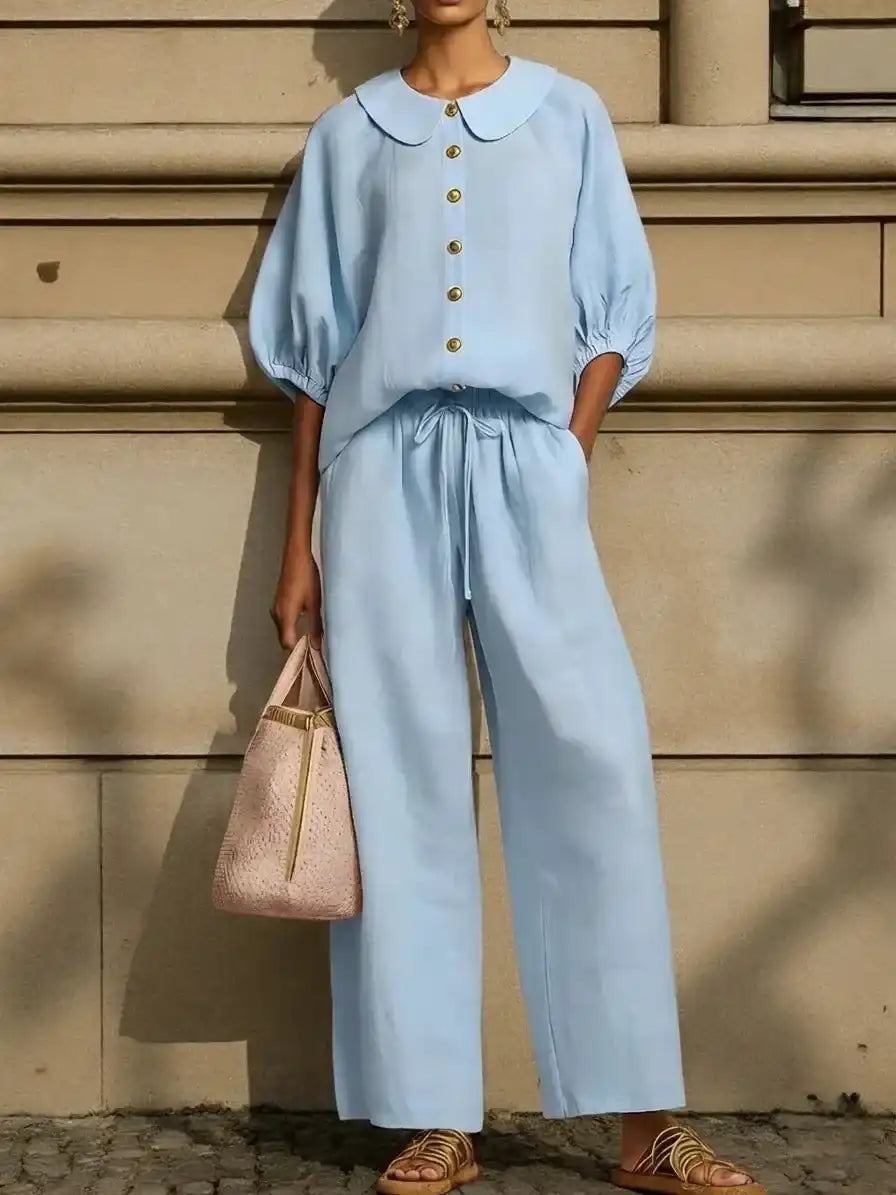 Light blue Peter Pan collar blouse with matching wide-leg pants, stylish plus size outfit for mature women