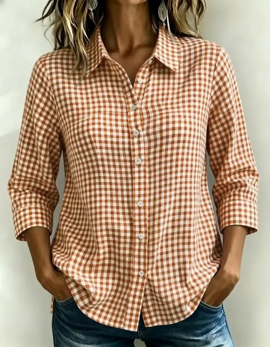 Rust and white gingham button-down shirt with rolled sleeves, styled with jeans for casual wear