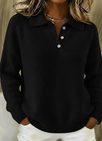 Black ribbed knit polo sweater with white buttons, relaxed fit for women, styled with white pants