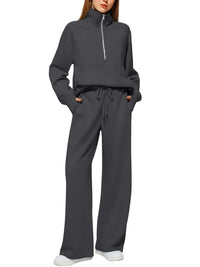 Dark gray relaxed fit lounge set with half-zip top and wide-leg drawstring pants for women