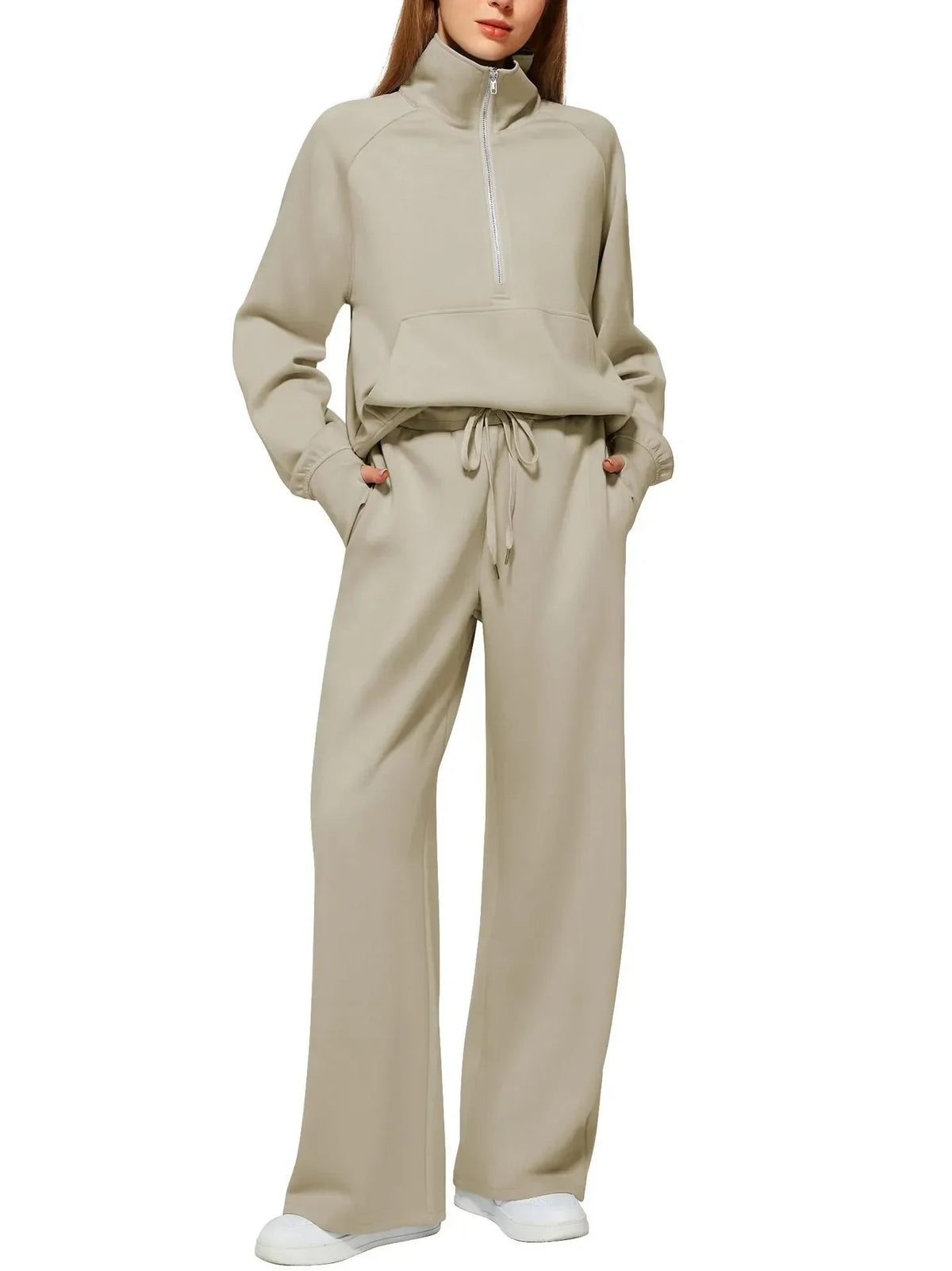 Beige relaxed fit lounge set with half-zip top and wide-leg pants, perfect for comfortable everyday wear.