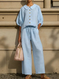 Light blue Peter Pan collar blouse with matching wide-leg pants, stylish plus size outfit for mature women