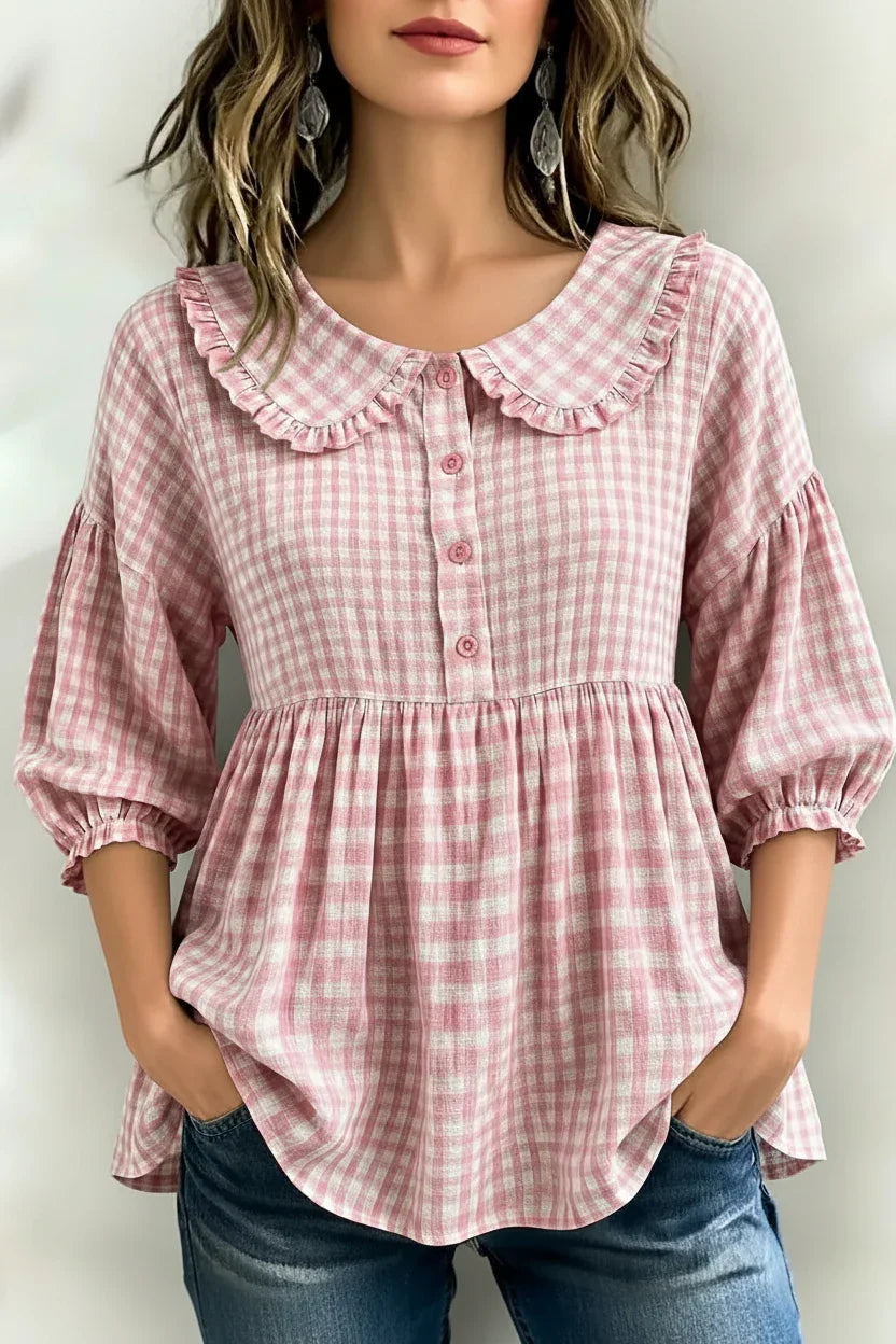 Pink gingham blouse with ruffled collar and puff sleeves for women, paired with jeans