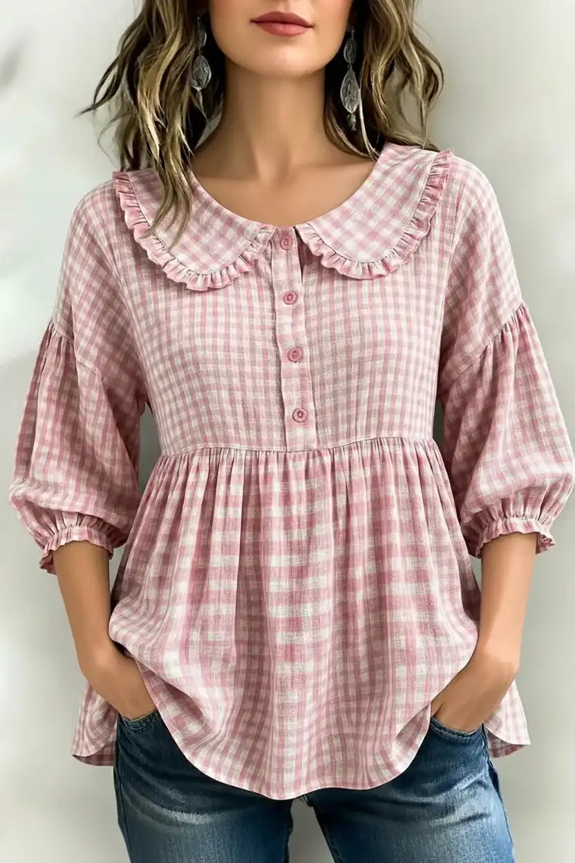Pink gingham blouse with ruffled collar and puff sleeves for women, paired with jeans