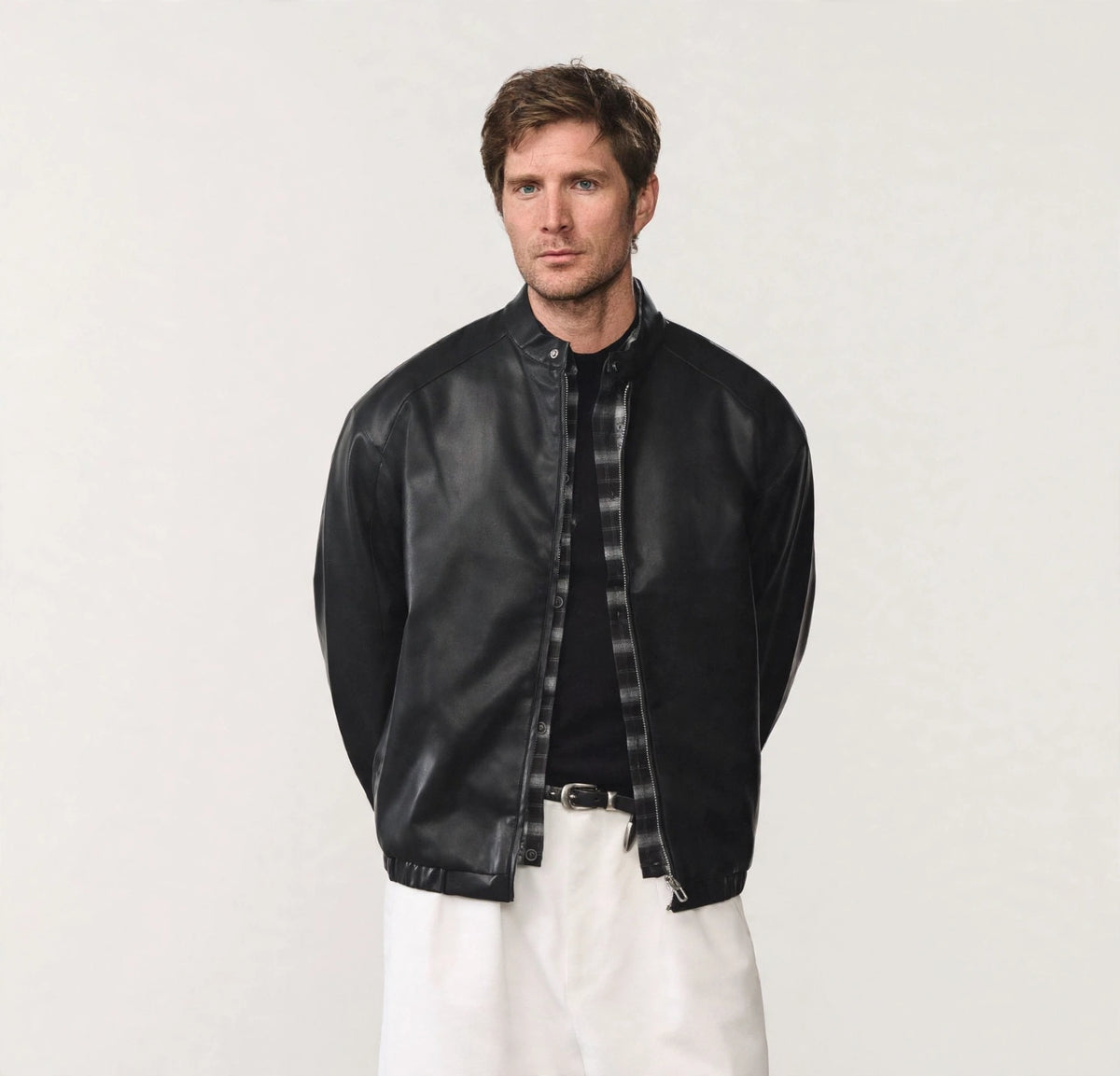 Men's black PU leather bomber jacket, worn open